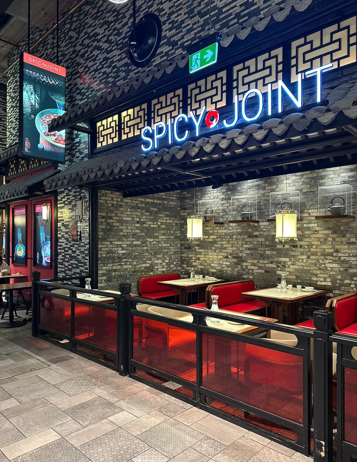 Spicy Joint shopfront and outdoor tables at Chatswood Interchange