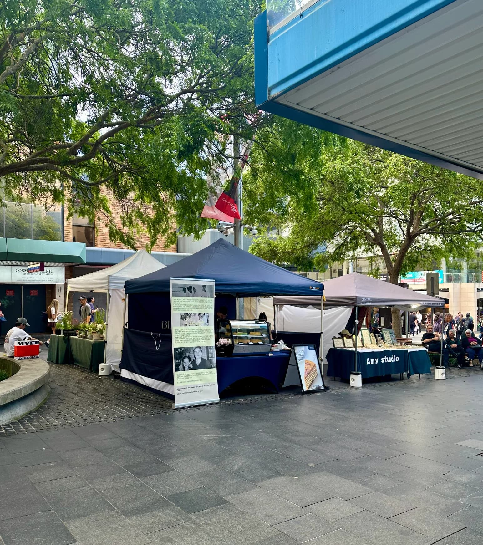 Market stalls beneath the trees at Chatswood Mall Market