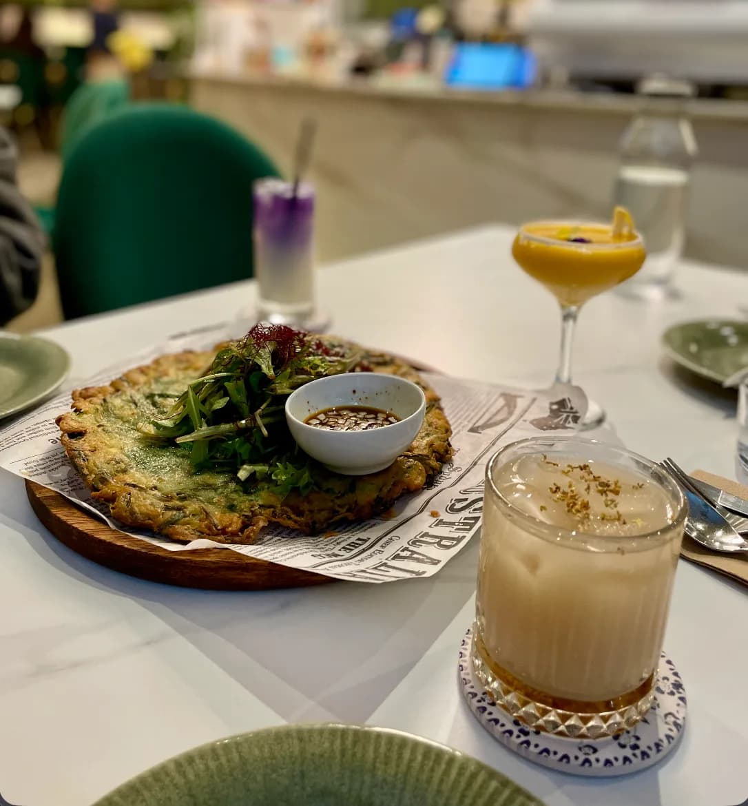 Seafood pancake and rice wine served at On point seafood cafe in chatswood place