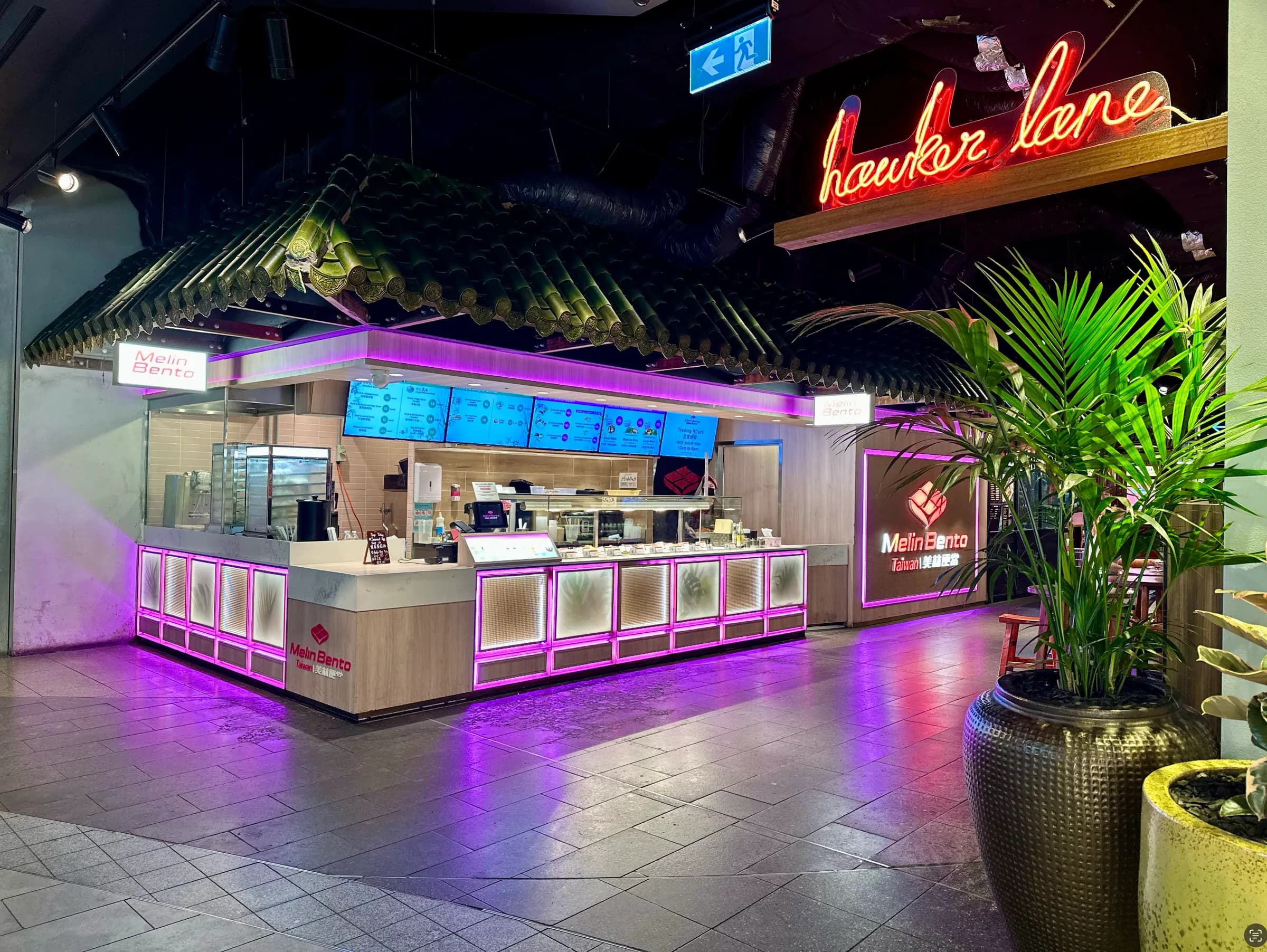 Food counter beneath the neon Hawker Lane sign at Westfield Chatswood